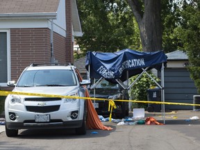 The scene of a crossbow shooting that left three people dead and one injured at 10 Lawndale Road in Toronto, Ontario on Friday, August 26, 2016.  (Laura Pedersen/National Post)    //NATIONAL POST STAFF PHOTO