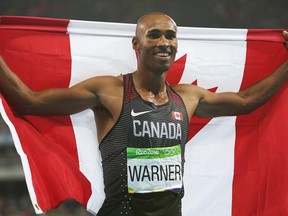 Damian Warner of Canada celebrates his bronze medal in the decathlon at the 2016 Summer Olympics in Rio de Janeiro, on Aug. 18, 2016.