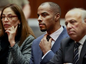 Darren Sharper (centre) appears with his attorneys, Lisa Wayne (left) and Leonard Levine, in Los Angeles Superior Court on March 23, 2015.