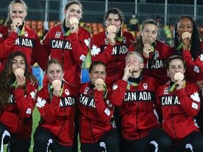 Team Canada celebrates winning the bronze medal over Great Britain