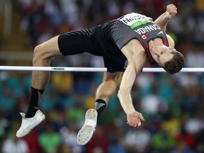 Derek Drouin of Canada competes in the men's high jump qualification at the Olympic Stadium in Rio de Janeiro, Brazil, on Sunday, Aug. 14, 2016.
