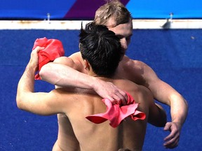 Jack Laugher and Chris Mears of Great Britain celebrate after their final jump in the Men's Diving Synchronized 3m Springboard Final at the Maria Lenk Aquatics Centre in Rio on Wednesday.
