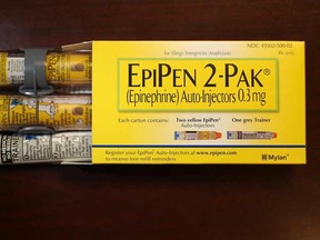 In this photo illustration, EpiPen, which dispenses epinephrine through an injection mechanism for people with severe allergies, is seen as the company that makes it Mylan Inc. has come under fire from consumers and lawmakers for the price that it is currently charging on August 16, 2016 in Hollywood, Florida.