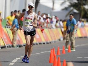 Evan Dunfee of Canada heads for the finish line in the men's 50-kilometre race walk at the 2016 Summer Olympics in Rio de Janeiro, Brazil on Friday, Aug. 19, 2016.