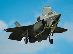 An F-35 Lightning II hovers in front of crowds during its first solo appearance at the Farnborough Airshow in England on July 12, 2016.