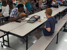 Florida State football player Travis Rudolph (left) sat down with sixth-grader Bo Paske during a visit to Montford Middle School in Tallahassee, Fla. on Aug. 30.