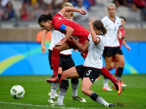 Christine Sinclair of Canada tries to split the German defence during the semifinal match on Day 11 of the 2016 Olympic Games at Mineirao Stadium in Belo Horizonte.