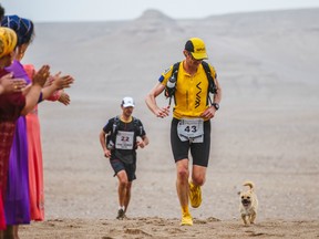 Dion Leonard and Gobi race through the desert.