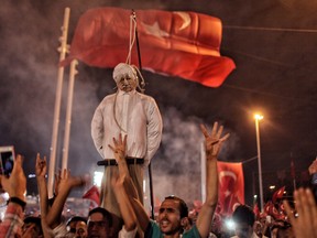 Supporters of Turkish President Tayyip Erdogan hold an effigy of U.S.-based cleric Fethullah Gulen after a failed coup attempt.