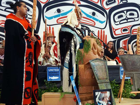 Darin Swanson, head chief of the Yahgulaanaas/Janaas clan at the ceremony where two hereditary chiefs were stripped of their titles. Ernest Swanson, his nephew is to the left holding a staff.