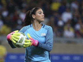 "Six-month suspension. No pay. Terminated contract. Effective immediately," Hope Solo said in a hotel conference room.