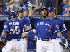 Edwin Encarnacion show shows his joy after Russell Martin hit a go-ahead three-run home run in the sixth inning of Saturday's 4-2 victory over the Houston Astros on Saturday at Rogers Centre.