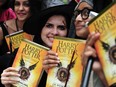 Fans in India pose with copies of J.K. Rowlings latest during an event to mark the book launch at a mall in Chennai on July 31, 2016.