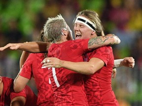 Canada's captain Jen Kish, left, celebrates the bronze medal-winning victory with teammate Karen Paquin on Monday, Aug. 8, 2016.