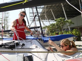 Danielle Boyd (L) and Erin Rafuse (R) of Team Canada prepare their 49er FX sailboat prior to going out for practice Marina da Gloria Venue at the Rio 2016 Olympic Park in Rio de Janeiro, August 07, 2016.