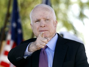 Sen. John McCain, R-Ariz, acknowledges a fellow Navy veteran during a Phoenix Memorial Day Ceremony at the National Memorial Cemetery of Arizona, Monday, May 30, 2016, in Phoenix.