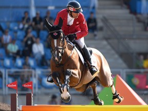 Canada's Eric Lamaze competes during the equestrian individual jumping final