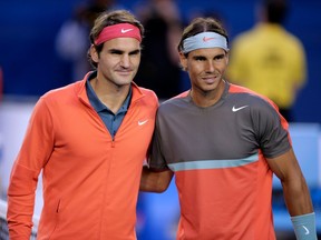 Rafael Nadal of Spain, right, and Roger Federer of Switzerland pose at the net before a match at the Australian Open on Jan. 24, 2014.