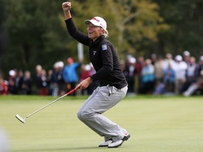 Alena Sharp celebrates her putt on the 18th hole during fourth-round play at the Canadian Pacific Women's Open on Aug. 28.