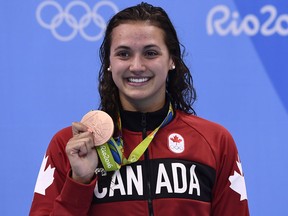 Canada's Kylie Masse poses with her bronze medal