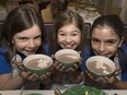 Actresses Hannah Levinson, 9, Jaime MacLean, 10 and Jenna Weir, 10, drink hot chocolate at the King Edward Hotel where they spoke with National Post reporter Alison Broverman about their role in the theatrical play Matilda.