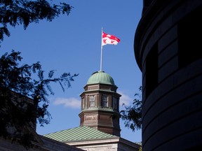 The McGill University flag flies from the top of the Arts Building.