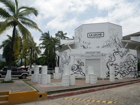 The entrance of the restaurant "La Leche" stands closed after armed men abducted as many as 16 people who were dining in the upscale restaurant in Puerto Vallarta, Mexico, Monday, Aug. 15, 2016.