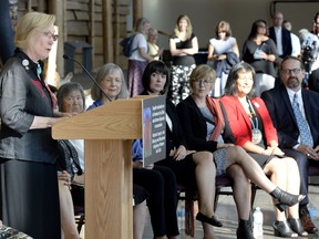 Elder Sally Webster, Commissioners Marion Buller, Qajaq Robinson, Marilyn Poitras, Michele Audette and Brian Eyolfson listen to Indigenous Affairs Minister Carolyn Bennett speak during the announcement of the inquiry into Murdered and Missing Indigenous Women at the Museum of History in Gatineau, Quebec on Wednesday, Aug. 3, 2016.