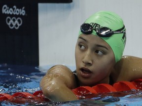 Nepal's Gaurika Singh looks up after winning a heat of the women's 100-meter backstroke.
