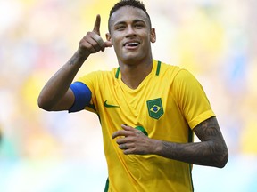 Brazil's Neymar celebrates after scoring a penalty against Honduras