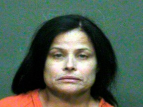 In this photo provided by the Oklahoma County Sheriff's Office, Juanita Gomez is pictured in a booking photo dated Aug. 28, 2016. Gomez is accused of killing her 33-year-old daughter, Geneva Gomez.