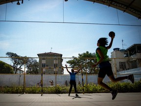 Girls play handball at the Vila Olimpica Greip, near the Rio 2016 Olympic Park.