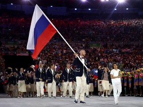 Russia's team, led by flag bearer Sergei Tetiukhin, marches into the Opening Ceremony at the 2016 Olympic Games.