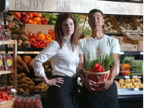 Alison Gilroy and Alan Yee amidst the fresh produce at their Calgary store.