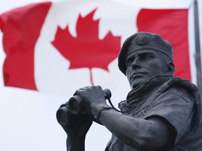 The Canadian Flag flies over the Peacekeeping memorial in Ottawa Tuesday May 29, 2012.