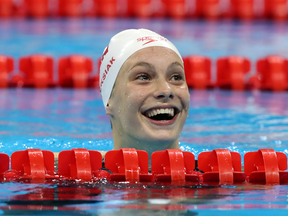 Penny Oleksiak smiles after seeing she tied for the gold medal in the women's 100m freestyle finals in Rio.