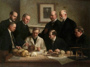 A 1915 portrait of the Piltdown skull being examined. Back row (from left): F. O. Barlow, G. Elliot Smith, Charles Dawson, Arthur Smith Woodward. Front row: A S Underwood, Arthur Keith, W. P. Pycraft, and Ray Lankester. Dawson is believed to have forged the skeleton.