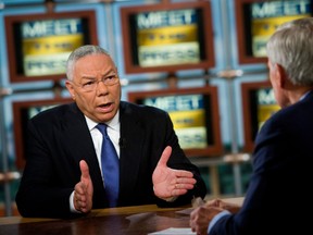 Former Secretary of State Colin Powell speaks to Tom Brokaw during a taping of Meet the Press in 2008.