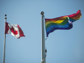 The Pride Flag flies at Queen's Park in Toronto. The Ontario government is working to make its legislation more inclusive of trans and non-binary individuals.
