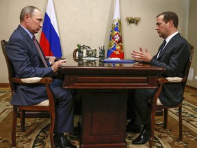 Russian President Vladimir Putin, left, and Prime Minister Dmitry Medvedev meet in Belbek in Crimea, Friday, Aug. 19, 2016.