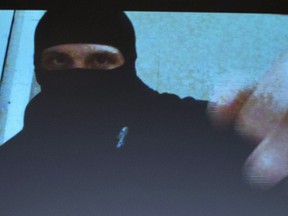 Aaron Driver switches off his video camera in a screen capture of a recording seen during a press conference for what the RCMP are calling a terrorism incident, in Strathroy, Ontario on Thursday, Aug. 11.