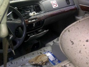 The aftermath of an explosion inside of a taxi that Aaron Driver entered after leaving a house in Strathroy, Ontario is seen in this undated handout photo.