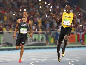 In this Aug. 17, 2016 file photo, Usain Bolt (right) wages his finger at Andre De Grasse at the end of their 200-metre Olympic semifinal in Rio.