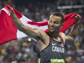 Andre De Grasse celebrates his bronze medal in the men's 100-metre final at the 2016 Olympic Games in Rio de Janeiro on Sunday, Aug. 14, 2016.