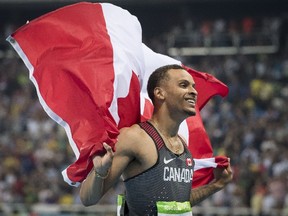 Andre De Grasse celebrates his bronze medal in the men's 100m Olympic final in Rio on Aug. 14, 2016.