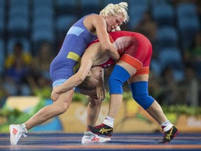 Dori Yeats tries to struggle free from a hold during a match against Jenny Fransson of Sweden in their women's freestyle wrestling 69-kilogram bronze-medal match at the 2016 Olympic Games in Rio de Janeiro, Brazil, on Wednesday, Aug. 17, 2016.