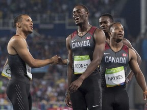 Members of the Canadian men's 4x100m relay team — from left, Andre De Grasse, Brendon Rodney, Aaron Brown and Akeem Haynes — after the Olympic final in Rio on Aug. 19. They won bronze.