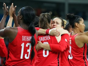 Canada's players console themselves and show their appreciation for the fans after being eliminated by France in a women's basketball quarter-final action at the 2016 Olympics in Rio de Janeiro on Tuesday, Aug. 16, 2016.