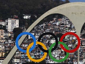 The Olympic Rings are seen with favelas in the background in Rio de Janeiro, Brazil. (Paul Gilham/Getty Images)