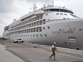 A federal police officer walks past the the Silver Cloud cruise ship before the U.S. men's basketball team arrives for the 2016 Summer Olympics in Rio de Janeiro, Brazil, Wednesday, Aug. 3, 2016.